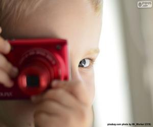 Puzzle Παιδί με φωτογραφική μηχανή φωτογραφιών